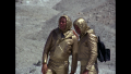 In their survival gear, Maj. Duke Danton and Capt. William "Buck" Rogers set out on foot to find Wilma Deering on Vistula (BR25: "Planet of the Slave Girls").