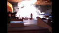 [Photo 6]: An explosion in Draconia's launch bay illuminates the blackened walls of the soundstage (BR25: Film, "Awakening").