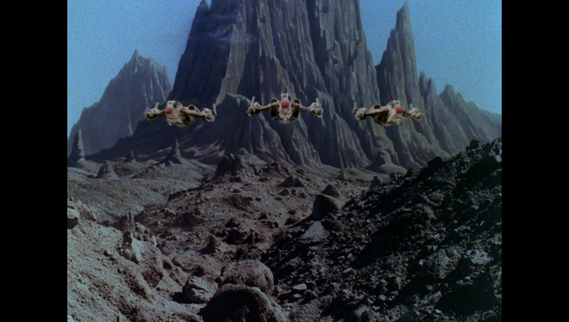File:BR25 - Planet of the Slave Girls - Scorpion Fighters Launch from the Sea of Stone.png