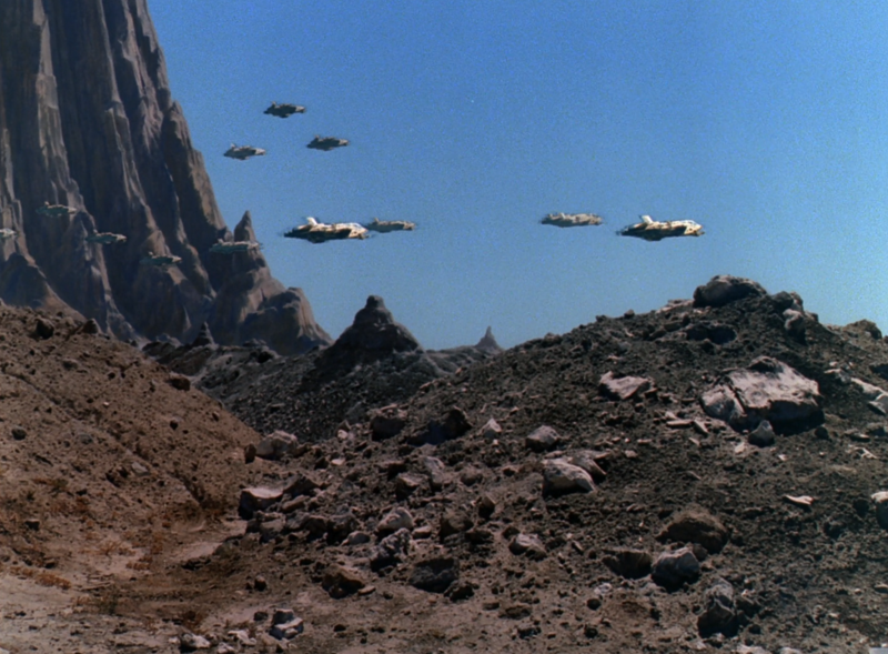 File:BR25 - Planet of the Slave Girls - Fighters Launch from the Sea of Stone.png