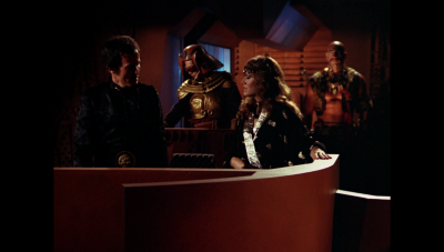 Kane, Princess Ardala, a Draconian warrior and Tigerman on Draconia's bridge, where Kane reveals his plan for William "Buck" Rogers to Ardala (BR25: Film, "Awakening").