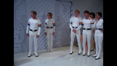 Earth Defense Directorate cadets are shown the "finer points" of football, courtesy of rough-housing between William "Buck" Rogers and Maj. Duke Danton (BR25: "Planet of the Slave Girls").