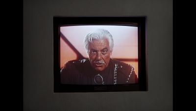 Amos Armat leaves a message for Felina Redding, warning her of a potential abduction (before she is abducted) (BR25: "Vegas in Space").