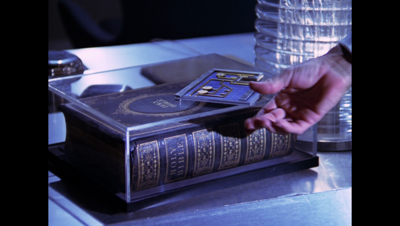 File:BR25 - Awakening - Bible and a Draconian Microtransmitter.png