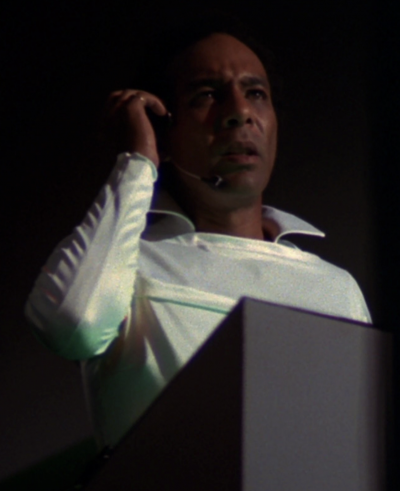 An unnamed Earth Defense Directorate officer, referred to by his callsign of Supervisor 14, at a nearby observation station when William "Buck" Rogers's singing comes through on the lower band transmission channels (BR25: Film, "Awakening").