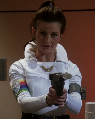 Maj. Marla Landers with an Earth Defense Directorate laser pistol (BR25: "Vegas in Space").