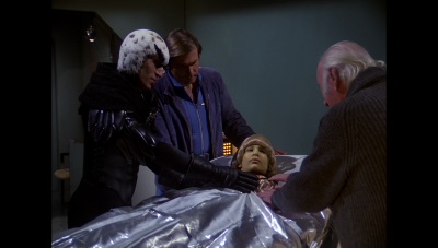 Buck Rogers in the 25th Century's "The Golden Man" aired this day, 19 February, in 1981 CE. Hawk, William "Buck" Rogers and Dr. Goodfellow speak to Velis in the medical bay after recovering Velis' capsule (BR25: "The Golden Man").