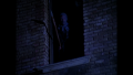 BR25 - Awakening - Mutant Looks on from Decrepit Building Window.png