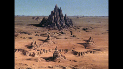 BR25 - Planet of the Slave Girls - Mountain in the Sea of Stone.png