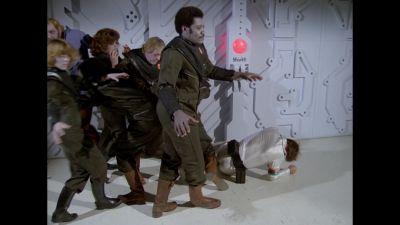 A throng of Vorvon thralls withdraw from their attack of William "Buck" Rogers after the security alarm is thrown (BR25: "Space Vampire").