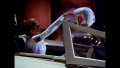 [Photo 3]: A hand-written sign is visible on the blank instrumentation panel as Wilma Deering retrieves her personalized helmet from atop her Thunderfighter's slide canopy (BR25: Film, "Awakening").