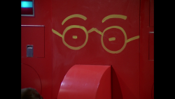BR25 - Rogers' Apartment - Dining Monolith with Painted Eyes and Eye-Glasses.png